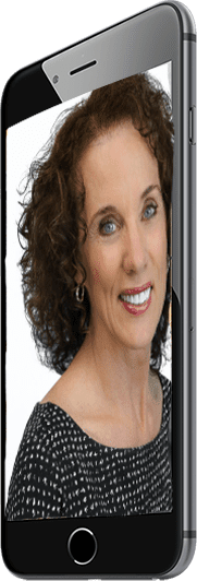 An image of a woman with curly hair on her phone.