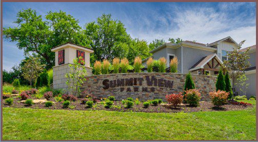 Landscaped Summit View entrance with stone sign