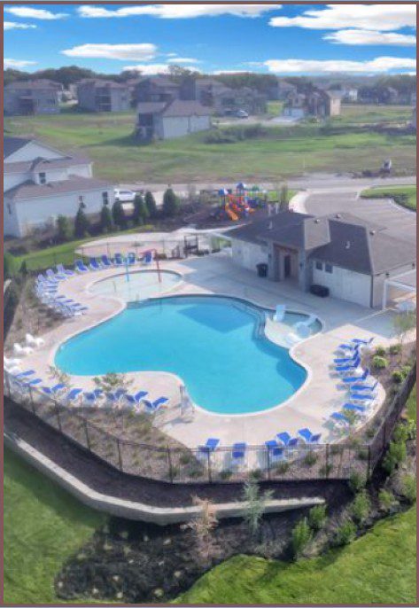 Aerial view of kidney-shaped community pool